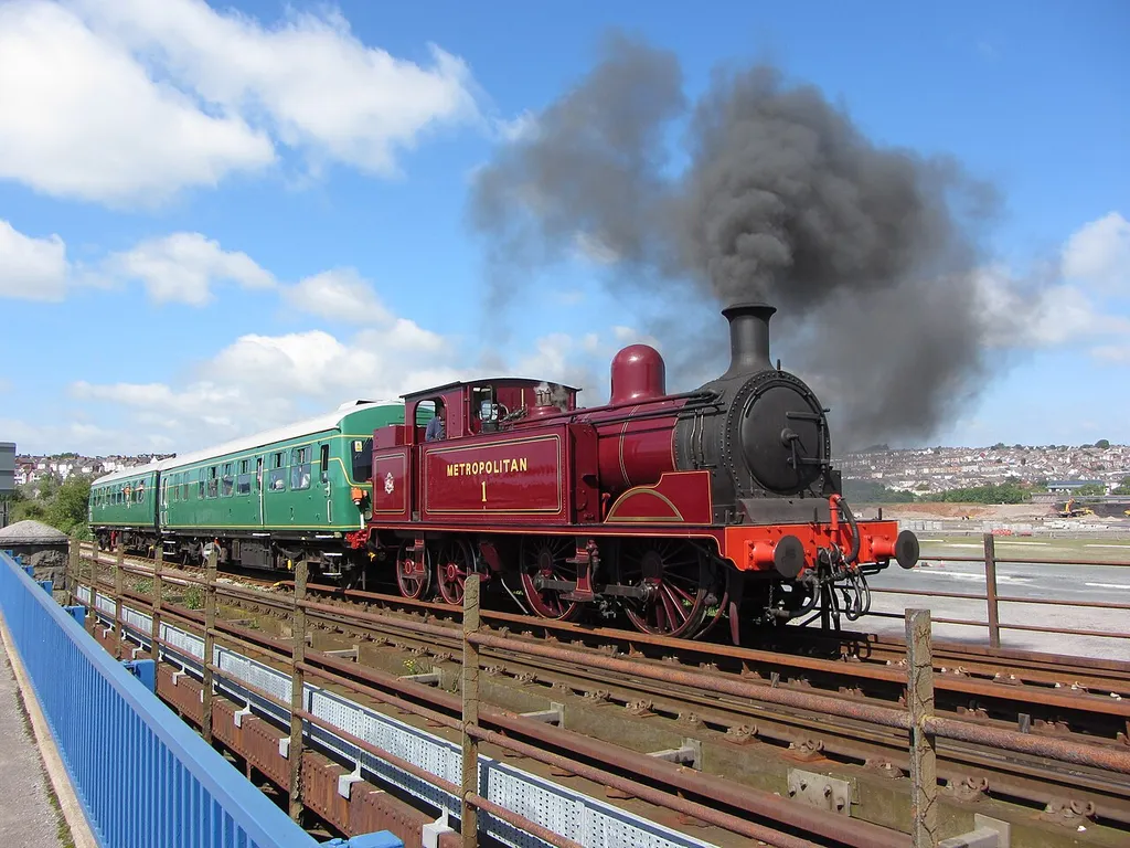 Barry Tourist Railway. Visiting locomotive, Met tank No. 1, crosses the causeway viaduct on the approach to Barry Island station.