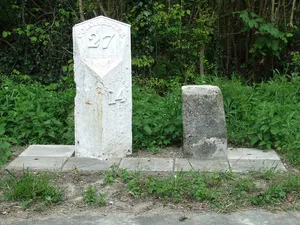 Milestone and milepost standing on the south side of Rowley Hill (A1017), around 60m south-east of its junction with Church Walk