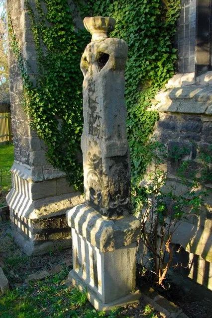Saxon stone cross in the churchyard of St Margaret of Antioch's parish church, Fletton, Peterborough, England