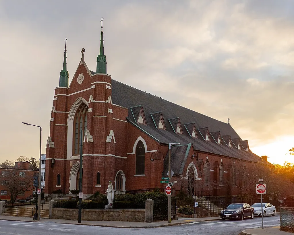 St. Thomas Aquinas Parish, the local Roman Catholic church, on South St. in Jamaica Plain, MA. Taken on a cold January day in 2022, as the sun went down.