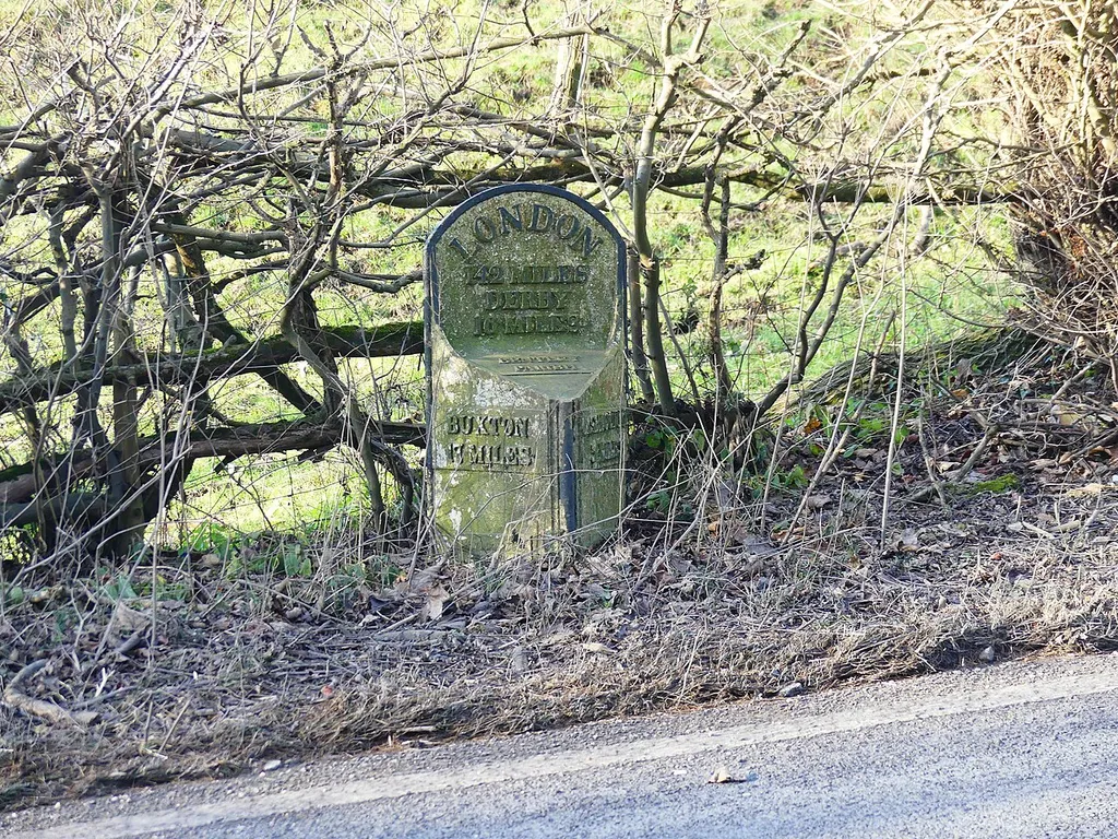 Grade II listed milepost in the parish of Fenny Bentley, Derbyshire. Listed as "Mile post, north of old railway bridge at NGR 173 512". .mw-parser-output .messagebox{margin:4px 0;width:auto;border-collapse:collapse;border:2px solid var(--border-color-progressive,#6485d1);background-color:var(--background-color-neutral-subtle,#fbfcff);color:var(--color-base,#202122);box-sizing:border-box;border-inline-start-width:8px}.mw-parser-output .messagebox.mbox-small{font-size:88%;line-height:1.25em}.mw-parser-output .mbox-warning,.mw-parser-output .mbox-speedy{border:2px solid var(--border-color-error,#b22222);background:var(--background-color-error-subtle,#ffdbdb);border-inline-start-width:8px}.mw-parser-output .mbox-serious,.mw-parser-output .mbox-delete,.mw-parser-output .mbox-stop{border:2px solid var(--border-color-error,#b22222);border-inline-start-width:8px}.mw-parser-output .mbox-issue,.mw-parser-output .mbox-content{border:2px solid #f28500;background:var(--background-color-warning-subtle,#ffe);border-inline-start-width:8px}.mw-parser-output .mbox-query,.mw-parser-output .mbox-style{border:2px solid #f4c430;background:var(--background-color-warning-subtle,#ffe);border-inline-start-width:8px}.mw-parser-output .mbox-shit{border:2px solid #960;border-inline-start-width:8px}.mw-parser-output .mbox-license{border:2px solid #88a;border-inline-start-width:initial}.mw-parser-output .mbox-legal{border:2px solid var(--border-color-notice,#666);background:var(--background-color-base,#fff);border-inline-start-width:8px}.mw-parser-output .mbox-honor{border:2px solid #ca3;background:var(--background-color-warning-subtle,#fcf4db);border-inline-start-width:8px}.mw-parser-output .mbox-growth{border:2px solid #8d4;background:var(--background-color-success-subtle,#d5fdf4);border-inline-start-width:8px}.mw-parser-output .mbox-move{border:2px solid #93c;border-inline-start-width:8px}.mw-parser-output .mbox-protection,.mw-parser-output .mbox-message{border:2px solid var(--border-color-bas