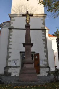 Wayside cross in front of church of Saint Giles