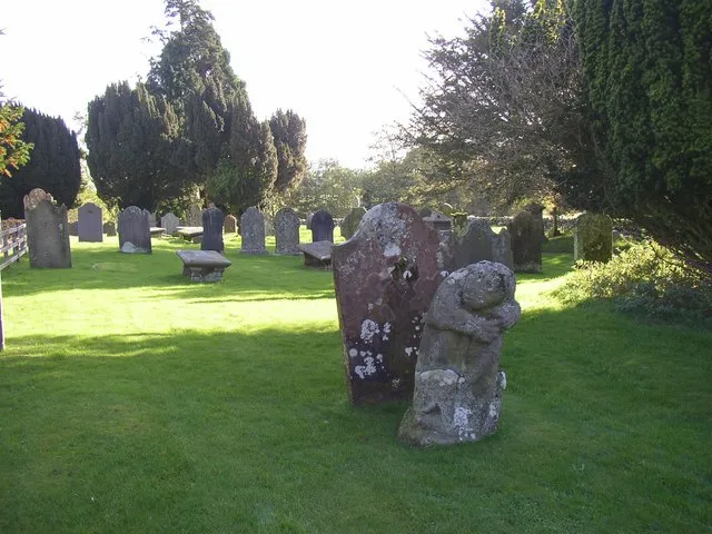 Dacre churchyard The four corners of the original churchyard (smaller than the present one) are marked by four medieval stone bears. They were studied by Chancellor Furguson in 1890, and he believed that they depict a legendary tale, which can be summarised by: bear sleeping, bear attacked by wild cat, bear shakes off cat, bear eats cat. The bear in this photo is the second in the sequence, but the cat has been worn away and we just see the bear looking over its shoulder.