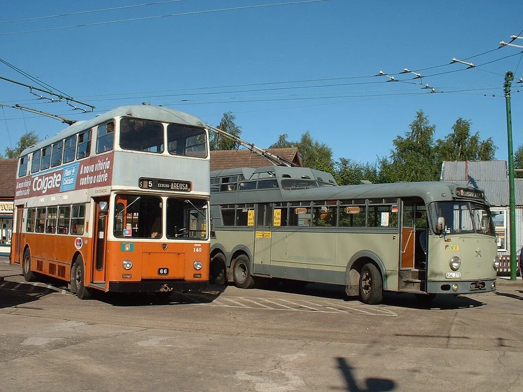 Two trolleybuses at The Trolleybus Museum at Sandtoft. On the left is No. 140 from Porto, Portugal, a 1967 Lancia. On the right is a No. 22 from Aachen, Germany, a one-and-a-half-decker built by Henschel.