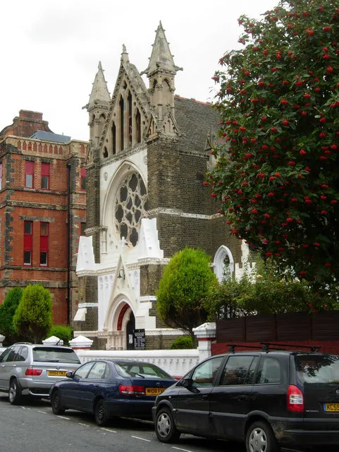 Faith Tabernacle Church of God, Dalston Seen here from Ritson Road, this church was built in 1876 as the Hamburg Lutheran Church in a German Gothic style to serve the community associated with the adjacent German Hospital. In the Second World War there was much paranoia directed at Britain's German community with the nursing staff at the hospital all arrested and interned on the Isle of Man; in the case of this church the concern was, however, perhaps justified. The Minister before the war was one Rev Schonberger, a notorious nazi, and it is said that the church housed a radio transmitter larger than the BBC's. The church passed to its present congregation in 1982, reflecting the changes in the composition of the local community.