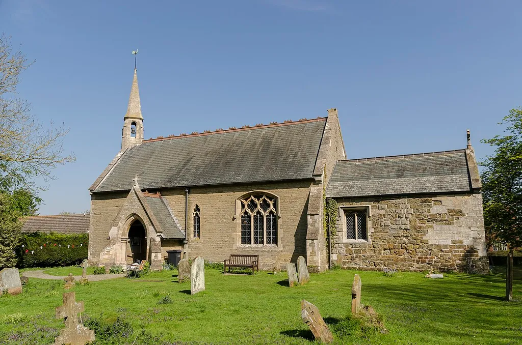 The church dates from around 1200, with further work in the 15th century. It was restored in 1863 by Ewan Christian. The church is built of Greenstone and has a western bellcote, nave with north aisle, chancel, south porch and vestry. The west end of the church has a large buttress supporting the bellcote with windows either side. The nave and aisles have been rebuilt in 1863, the chancel has mediaeval fabric with brick patching, the east window dating from the 15th century. The three Bay north arcade dates from around 1200 but the piers and responds have been rebuilt in the 19th century. The roofs and fittings are 19th century including the font. On the east wall of the nave are fragments of an early 13th century carved cross. The chancel still retain some mediaeval fabric and the east window dates from the 15th century. The south porch dates from the 19th century, as do the fittings and the roof. The screen was reconstructed in the 19th century and contains some 15th century panels. There is also a 12th century octagonal font which was recovered from below the altar in 1930. There is also a modern font with wooden cover. There is a small one manual organ. There is no stained-glass in the church. In 2008 there was an earthquake in Lincolnshire which caused damage to the bellcote. This had to be removed in rebuilt at a cost of some £23,000.