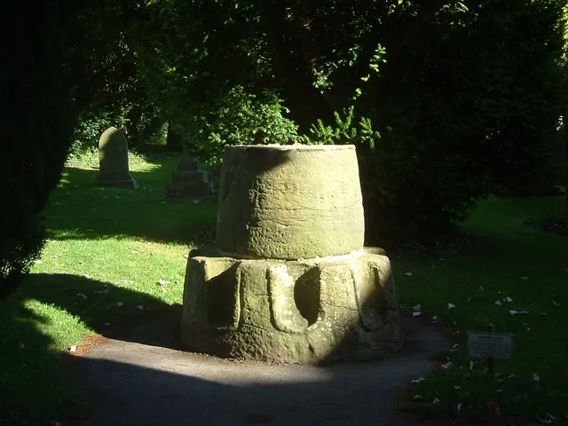 Penitents stone in churchyard at Ripley Base of ancient "penitents" or "weeping cross" with niches for 8 penitents to kneel in. Situated in churchyard.