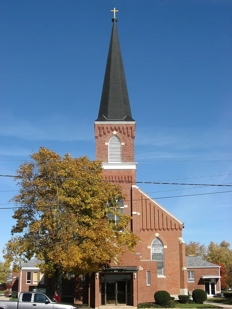 Front of St. Nicholas' Catholic Church, located at the junction of Main (State Route 705) and Church Streets on the eastern side of Osgood, Ohio, United States. Built in 1907, the church and its rectory were added to the National Register of Historic Places as a part of the Cross-Tipped Churches of Ohio Thematic Resources.