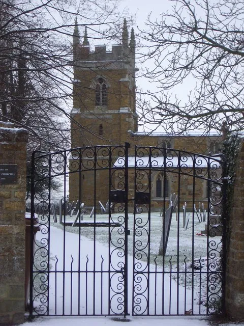 St Mary the Virgin parish church, Nether Broughton, Leicestershire, in snow. The churchyard gates are a monument to Sir Winston Churchill, installed after his death in 1965.