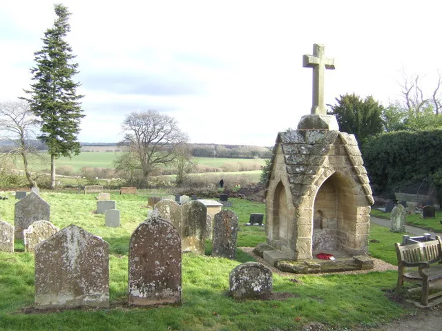Kinlet; cross and churchyard The mediaeval stone cross has been restored recently, with a new top stone. Local parishioners were working on clearing dead trees from near the entrance on this December afternoon.