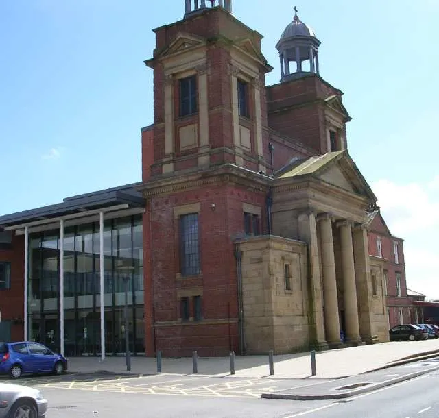St Augustine's Leisure Centre, Austin Place, Preston, Lancashire, seen from the north. The facade is all that remains of the former Roman Catholic Church of St Augustine, built in 1840. The area around the church, with buildings that have since been demolished, was used in the Hetty Wainthropp Investigates episode "Digging for Dirt".
