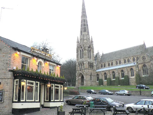 View northwest from Fulwood Road, Ranmoor, Sheffield, South Yorkshire. On the left is The Ranmoor Inn; on the right is the parish church of St John the Evangelist.