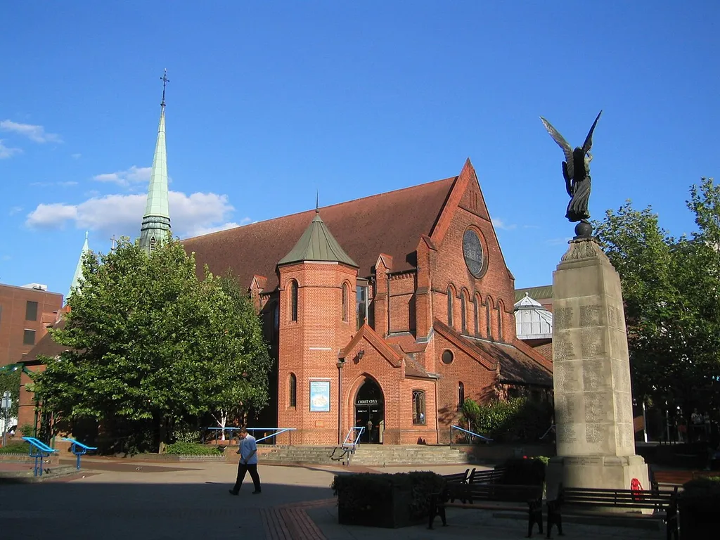 Town Square in Woking, Surrey, UK, featuring Christ Church and the War Memorial.