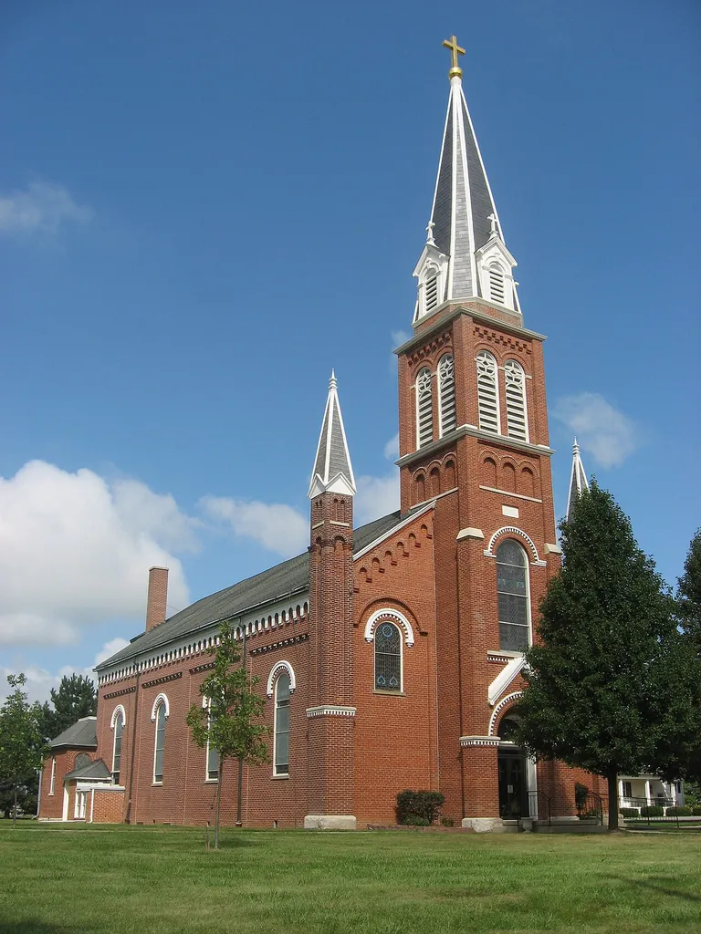 Front and southern side of St. Anthony's Catholic Church in Padua, an unincorporated community in Washington Township, Mercer County, Ohio, United States. Note the distinctive and unusual pilasters on the corners of the facade. Built in 1869, the church was listed on the National Register of Historic Places as a part of the Cross-Tipped Churches of Ohio Thematic Resources.