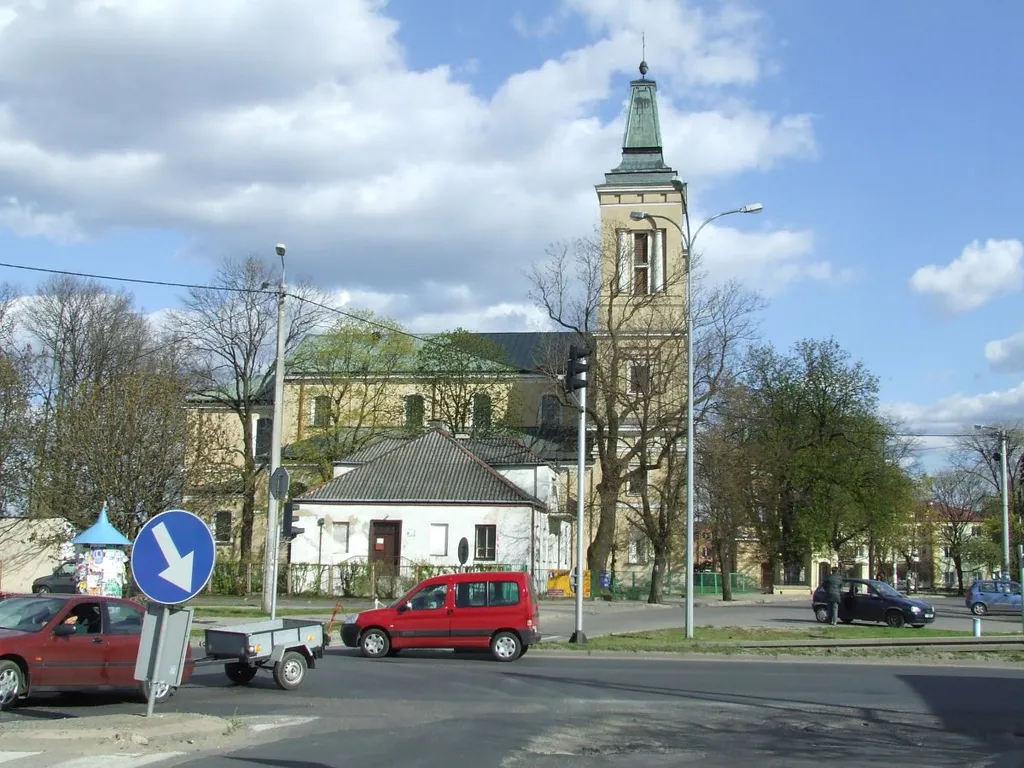 Radzymin, classicist colegiate church of Transfiguration of Jesus, with a . Originally built by Johann Christian Kammsetzer (main aisle and the bell tower, as well as the school and poorhouse visible in the foreground) while the later additions (side aisles, presbyterium and two towers) were added by Konstanty Wojciechowski.