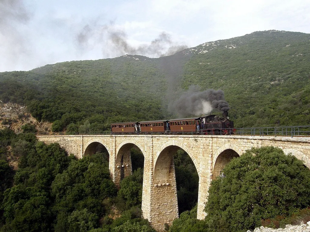 Greece: A Tubize narrow gauge (600 mm) locomotive hauls a charter train from Ano Lechonia to Miles on the Pelion Railway.