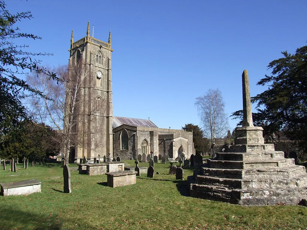St Andrew's parish church, Chew Magna, Somerset, seen from the southwest. On the right in the foreground is the churchyard cross.