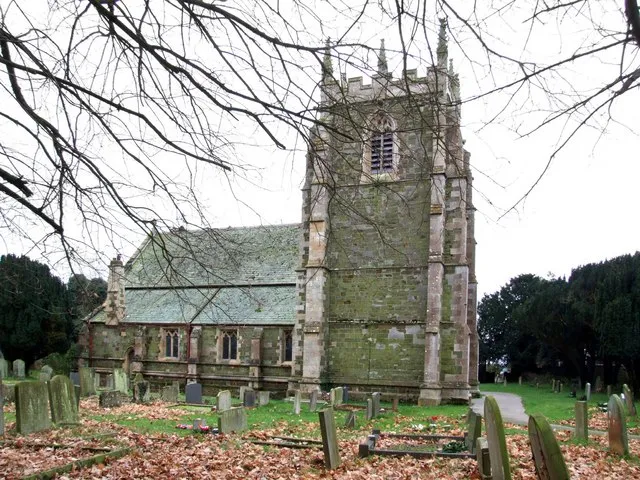 St Peter &amp; St Paul, Old Bolingbroke A camera angle that is nigh on impossible when leaves are on the trees. The church sits at the very edge of the Wolds and close to the ruins of the castle, which was the birthplace of Henry IV in 1366. There was a church here as early as 1086, but the present church is the south aisle of a church built about 1363. This was badly damaged during the Civil War and was restored to its present form by Reverend Edward Pain in 1889. The window in the east wall is a fine example of 14th-century work. On either side of the window are two carved heads said to represent King Edward III and Queen Philippa whose son, John of Gaunt, is thought to have built the church.