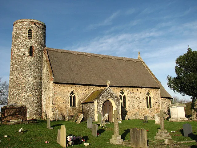 St Edmund's church St Edmund's church has a thatched roof, a round tower, and a tiny Norman chancel with pillar piscina, vaulted roof, sanctuary arch and small lancet windows. Outside, a trapdoor under the eaves of the chancel on the south side leads to what is traditionally called the Smuggler's Loft: brandy for the parson and tobacco for the squire. The apse is painted with the Martyrdom of King Edmund of the East Angles; the painting dates to the 12th century. A 14th century painting of St Christopher can be seen on the north wall of the nave. http://www.paintedchurch.org/frited.htm The church is open every day.