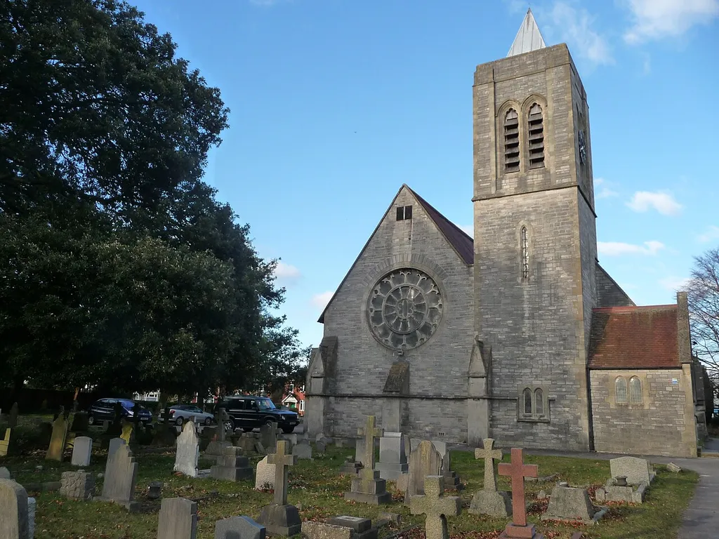 St John the Baptist's parish church, Wimborne Road, Moordown, Bournemouth, seen from the north. The lower stages of the north tower were designed by GE Street and completed in 1874. The belfry was designed by Sidney Tugwell and completed in 1923.