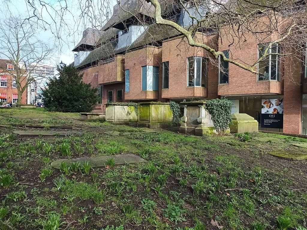 Group Of 4 Churchyard Tombs, in Reading Minster (St Mary's) churchyard in Reading, Berkshire, UK. Behind the tombs is Chain Street and the side of John Lewis.
