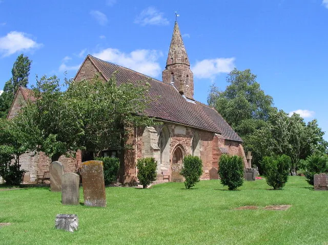 Church of St John the Baptist, Baginton (view NE) Sandstone construction. According to Pevsner, the chancel is Norman, the lancet windows and priest's doorway indicate 13th century. He also describes the bell-turret as "corbelled out below and square and then pulled in to make an octagonal top stage with short spire".