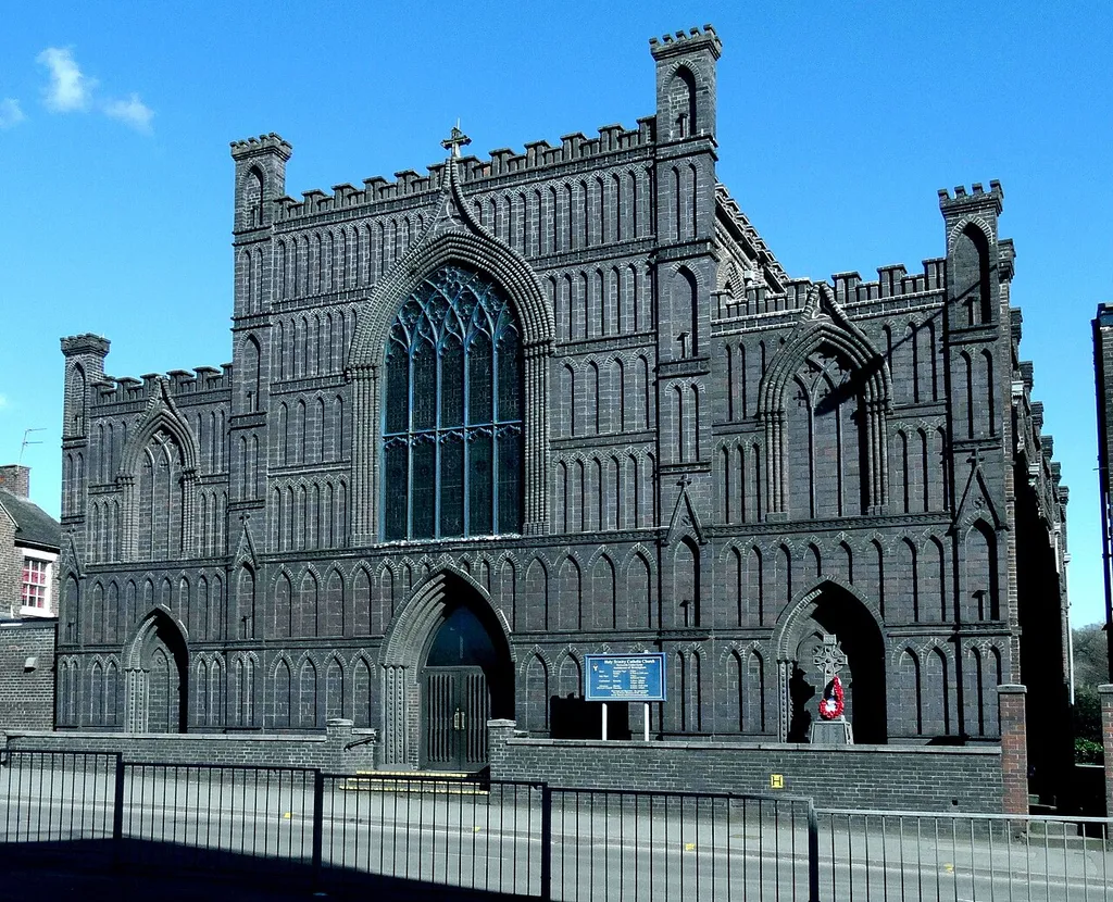 Holy Trinity Roman Catholic Church, in Newcastle-under-Lyme, Staffordshire, England (Staffordshire blue bricks). This is an edited extract from File:Holy Trinity Church, Newcastle-under-Lyme by Colin Park geograph 5218447.jpg.