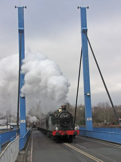 5643 on the swing bridge, near to Larches, Lancashire, Great Britain. Former Great Western Railway 56XX Class 0-6-2T 5643 crossing the combined road and rail swing bridge at Preston Marina