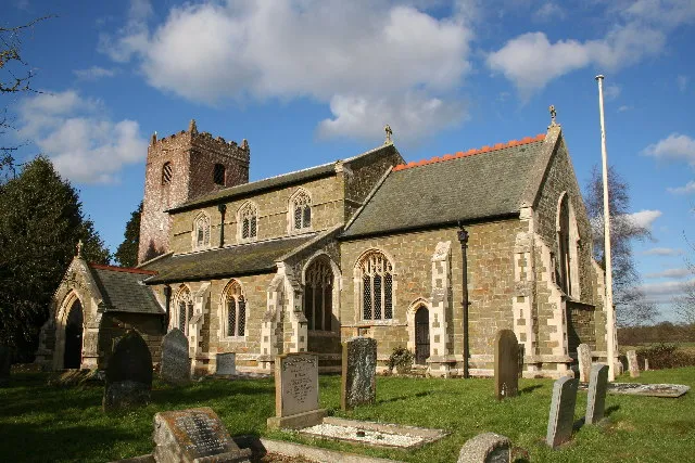 St.Peter &amp; St.Paul's church, Bratoft, Lincs. A typical Lincolnshire marshland greenstone Perpendicular church with an atypical brick tower of 1747. Some wonderful poppy head bench ends in the chancel and a strange curiosity ... a large allegorical painting of the defeat of the Spanish Armada. Painted soon after 1588 by Robert Stephenson, it depicts a red dragon, ships &amp; soldiers and an inscription recounting the defeat. It's hard to see the detail high up on the west wall, but there are postcards for sale.