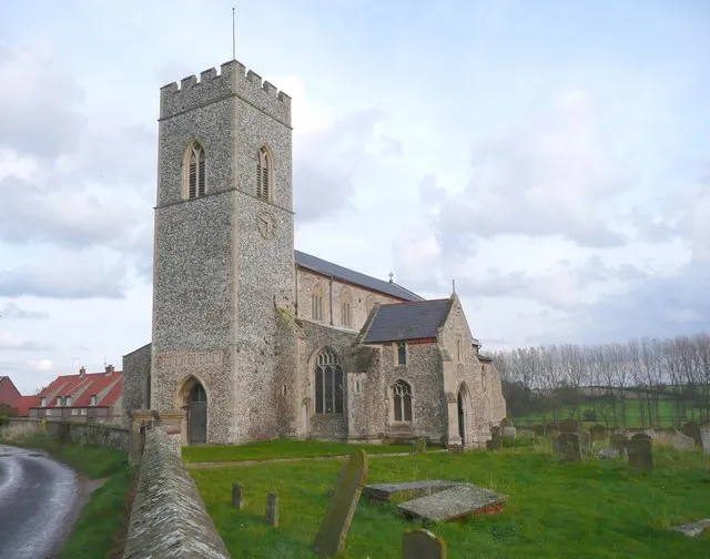 All Saints Church, Wighton A large church. The tower is of c.1300 according to Pevsner. There is a two-storey porch, and the nave is very high, with tall clerestory windows.