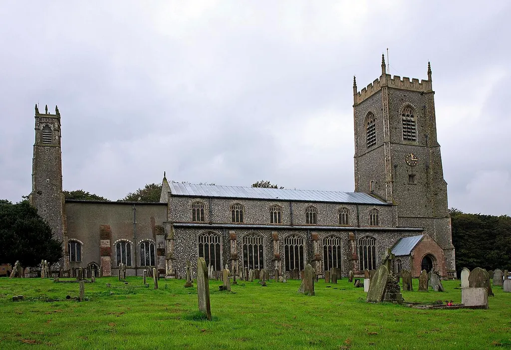 St Nicholas Church, Blakeney, Norfolk, England. It has a 15th century tower and a smaller beacon tower.