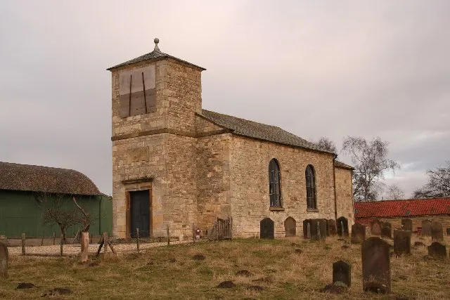 St.John the Baptist's church, Stainton-by-Langworth, Lincs. In the small hamlet of Stainton-by-Langworth, approached through a farmyard, the little Georgian church of 1796 incorporates a few pieces of medieval stonework.