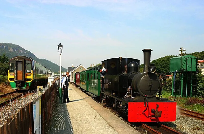 A Sprinter passes a train of the Welsh Highland Heritage Railway at Porthmadog.