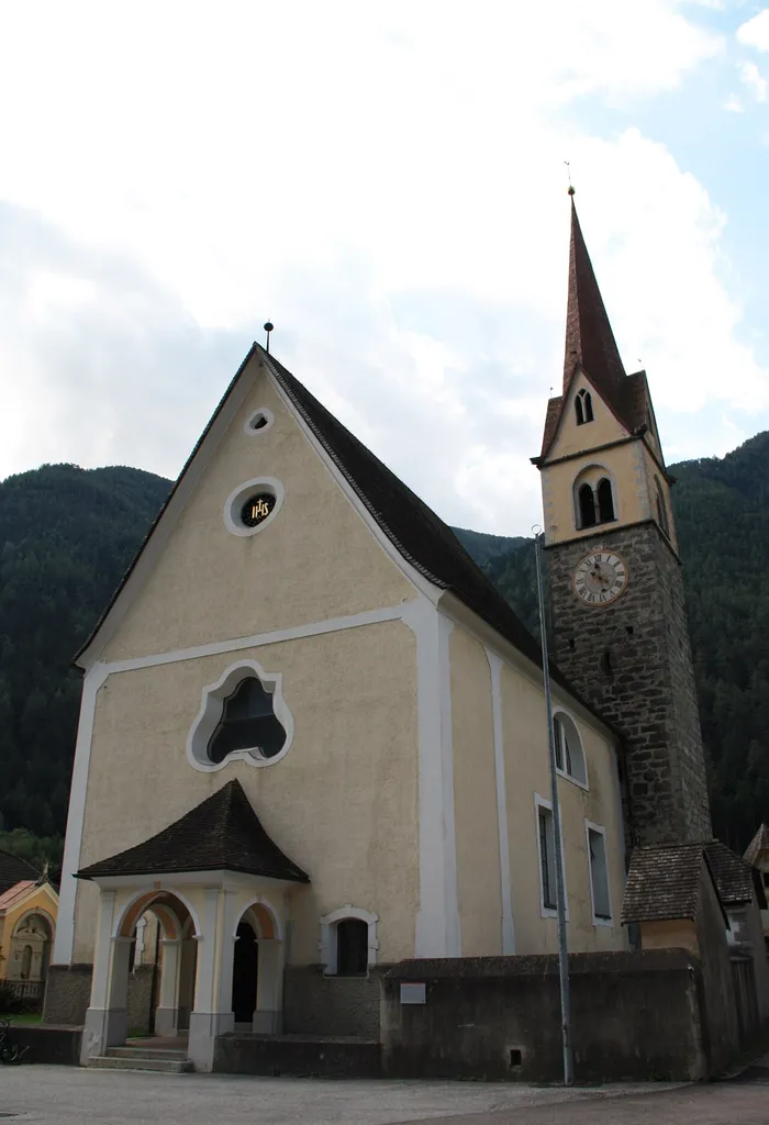 Italy, South Tirol, Mittewald, Pfarrkirche zum Hl. Martin. The first evidence of a church in Mittewald date back to 1345 and was reconsacrated in 1473. The present church was built in 1831 under the direction of Jakob Prantl then curate of Pfitsch who incorporated the Late Gothic bell tower in the new church. The ceiling frescos representing the Adoration of the Sacrament by the four continents and the death of Saint Martin are by Josef Renzler dating from 1832. The altarpieces represents the death of Saint Martin, the adoration of the Magi and Saint Sebastian are by Josef Renzler.