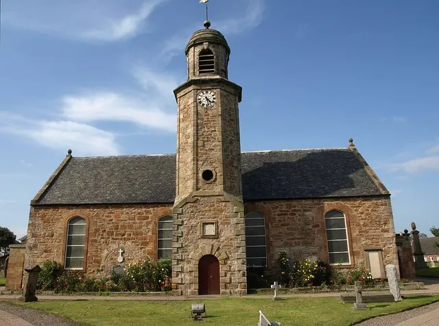 Elie Parish Church. Another view of 375829. "This dates back to 1639, though the unusual tower was added in 1729. The clock was in turn added to the tower in 1900, though because there were no buildings north of the church at the time, it only has three faces". http://www.undiscoveredscotland.co.uk/elie/elie/index.html