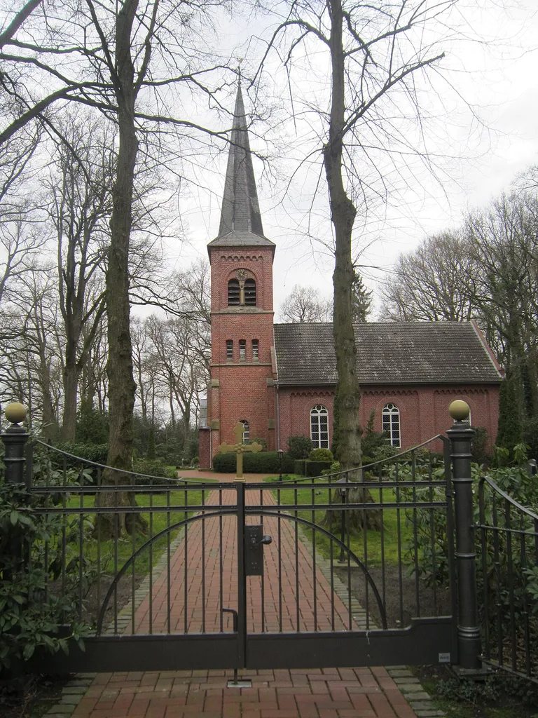 Lutheran Church in Wulfenau (Dinklage in Lower Saxony), built in an early historicistic style indmidst the parish cemetery looking like a park