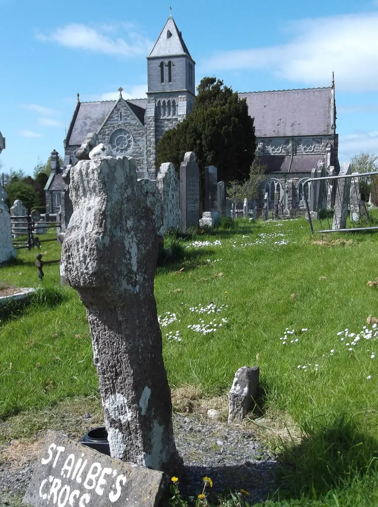 Photograph of St Ailbe's Cross, and Church of St Ailbe, Emly, Co. Tipperary, on the site of an earlier cathedral and monastery