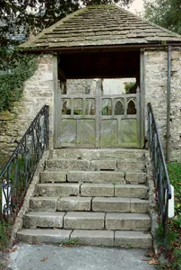 Lych Gate With Steps And Attached Churchyard Wall On 4 Sides Of Yard