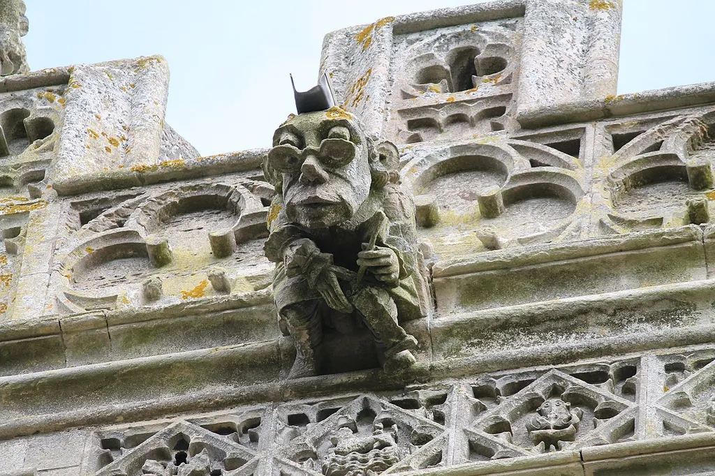 Gargoyle with spectacles on Holy Cross parish church, Great Ponton, Lincolnshire