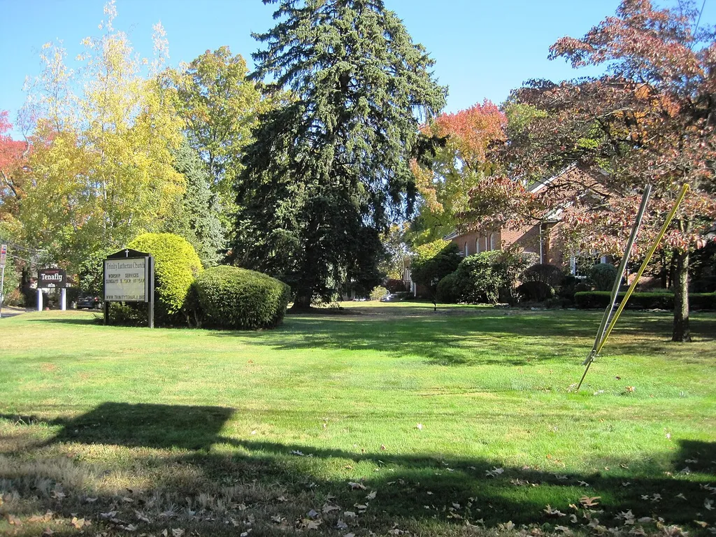 Photo of the front of Trinity Lutheran Church in Tenafly, New Jersey. Photo taken from County Route 505 (Knickerbocker Road) looking east.