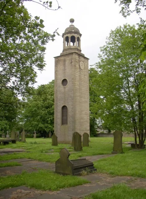 Tower of the former St Matthew's parish church, Lightcliffe, West Yorkshire. The church was first built in 1529 as St Matthew's Chapel, a chapel of ease in Halifax parish. Ir became known as Eastfield Chapel. It was suppressed about 1547 but restored in 1598. It was made a parish church in 1749. It was rebuilt in 1775 to designs by the architect was William Mallinson of Halifax. It was replaced in 1875 by a newer St Matthew's parish church further up Wakefield Road. All of the old church except the tower was demolished in 1969. In the belfry is a stone taken from an earlier church on this site, inscribed: Deo et Sancto Mattaeo Apostolo Evangelistae Martyri Sacra A. O. DCXXIX.