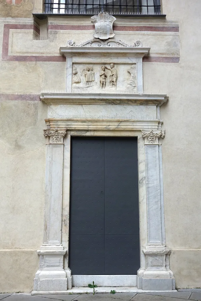 Exterior view of doorway, Museo Diocesano, Via Tommaso Reggio, 20 r, Genoa, Italy. All artwork in this museum is old enough so that it is in the public domain. Photography was permitted in the museum without restriction.