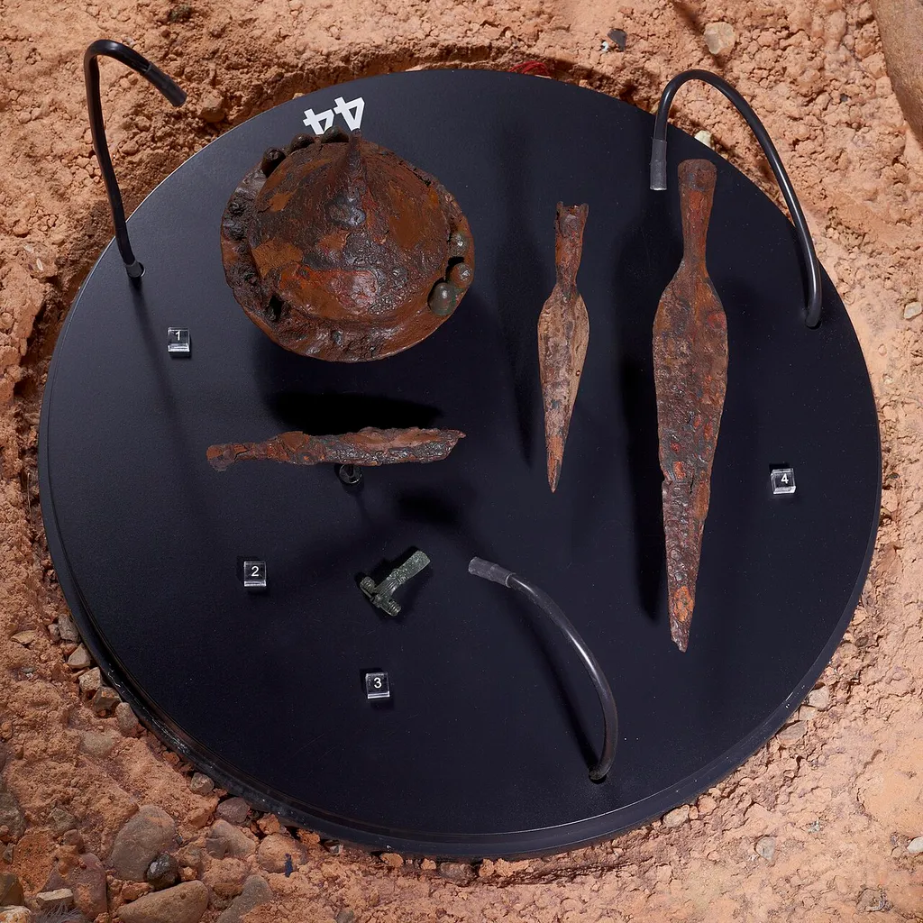 Part of grave inventory of Langobardic warriors burial Hamburg-Marmstorf Grave 216. Consisting of a shield boss (1) with handle (2), a bronze fibula (3) and two spear heads (4) in the showcase of the permanent exhibition.