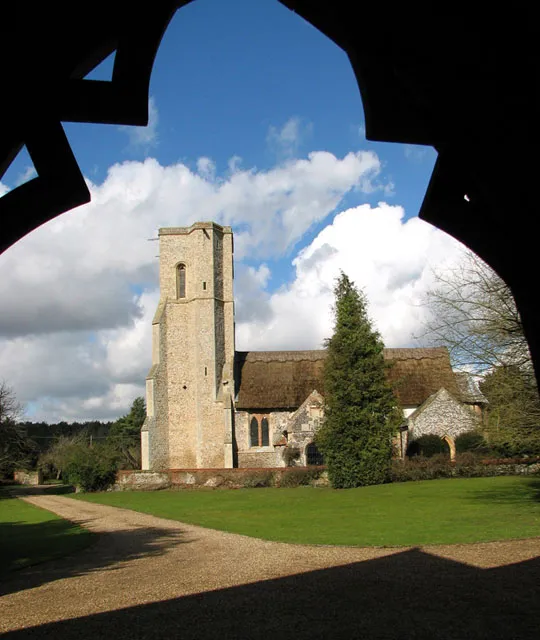 Parish church of St John the Evangelist, Rushford, Norfolk, seen from the south from the porch of the former Rushford college