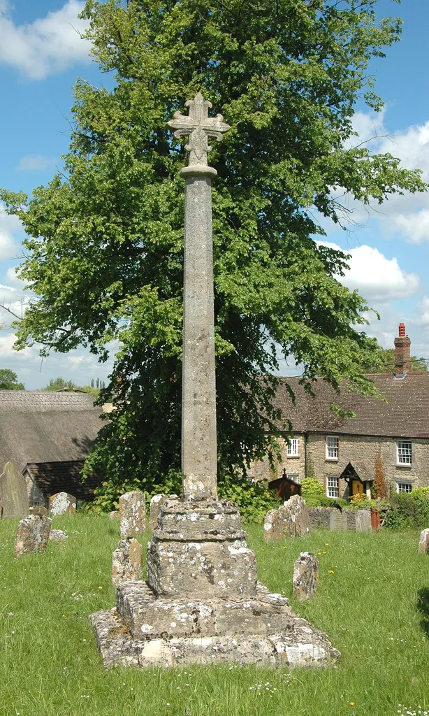 Stone cross in St Michael's parish churchyard, Cumnor, Oxfordshire (formerly Berkshire): 15th-century late Gothic base and steps and 19th-century Gothic Revival shaft and top