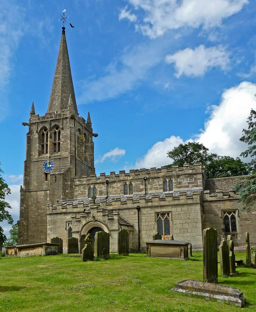 Nave, west tower and spire of All Saints' parish church, Kirk Deighton, North Yorkshire, seen from the south