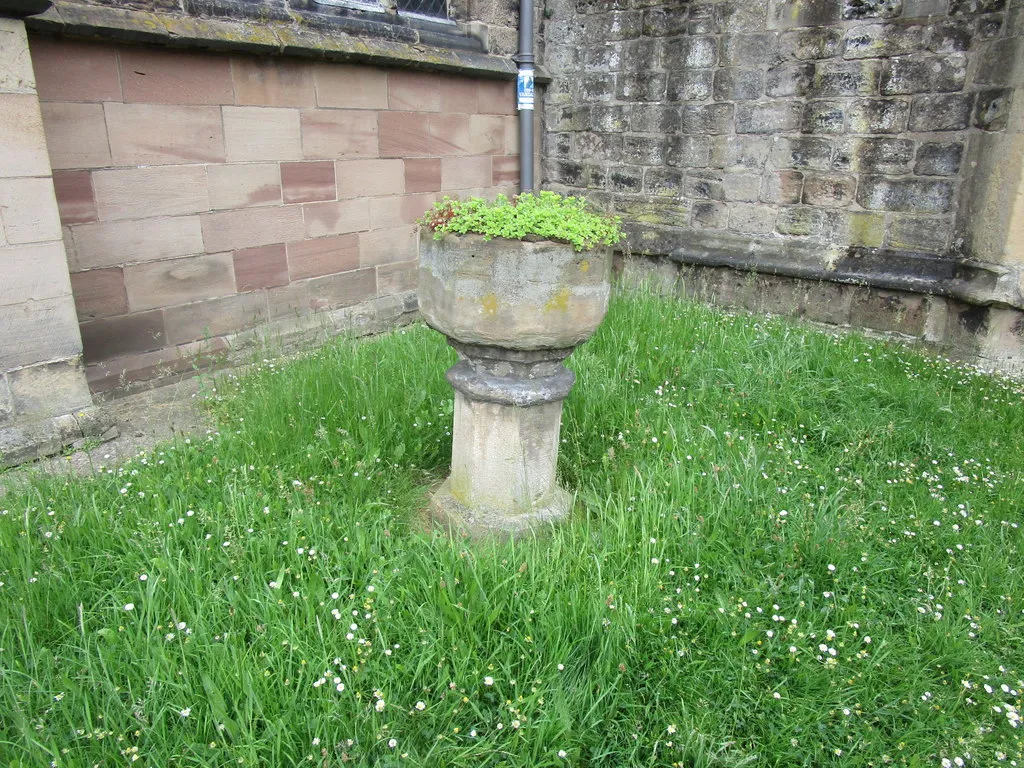 Photograph of the font, in the churchyard of All Hallows Church, Gedling, Nottinghamshire, England