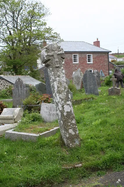 Ancient stone cross in the churchyard at Sancreed One of several ancient crosses in this churchyard, this one dates from the 10th Century. In the background can be seen the former Vicarage.