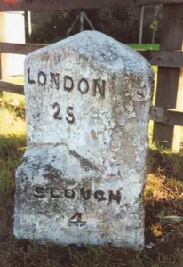 Milestone, Bath Road; W of Railway bridge, beside petrol station, opp. Pub (was Dumb Bell Hotel)