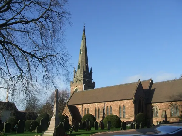 St Benedict Biscop parish church, Wombourne, Staffordshire, seen from the southeast. On the left in the foreground is Wombourne war memorial.